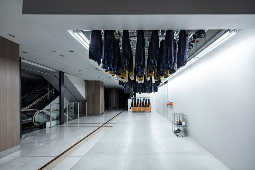 schemata architects completes 'descente blanc' store in sapporo with movable hanger system