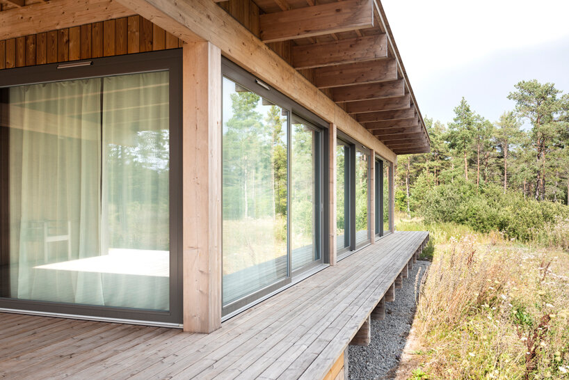 scott rasmusson källander builds five timber houses on a swedish island designboom