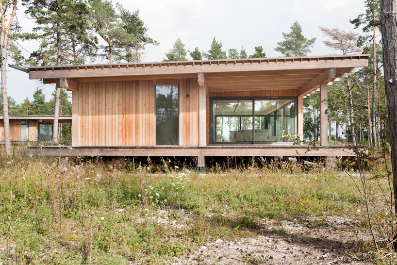 scott rasmusson källander builds five timber houses on a swedish island designboom