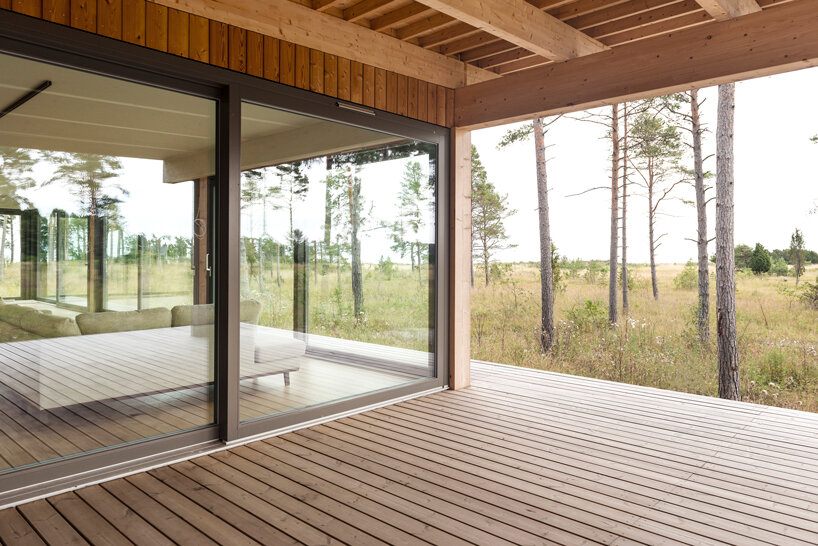 scott rasmusson källander builds five timber houses on a swedish island designboom