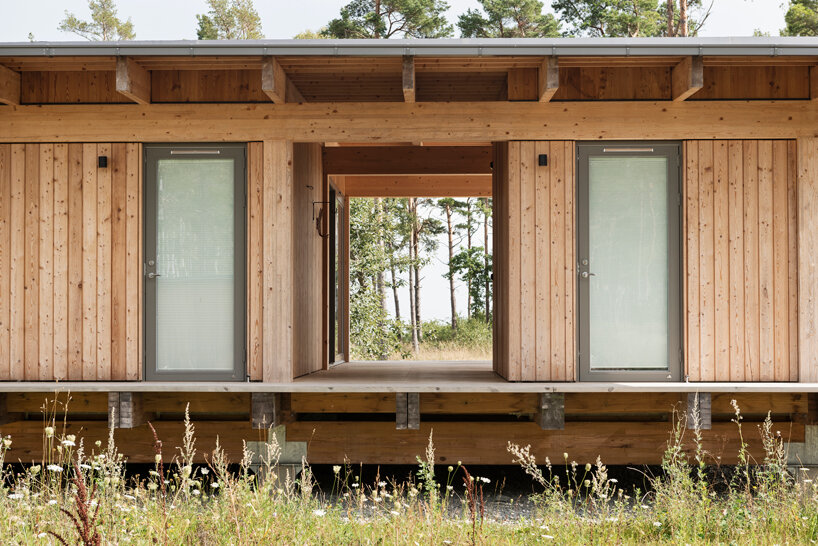 scott rasmusson källander builds five timber houses on a swedish island designboom