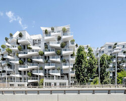 triangular white balconies protrude from valode & pistre's housing complex in france