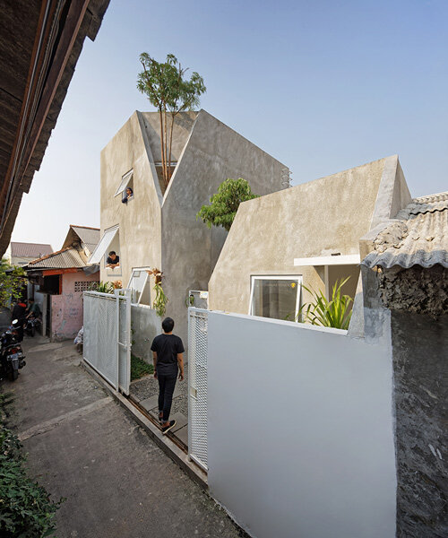 'the twins' by DELUTION are a pair of houses in indonesia with integrated vegetation