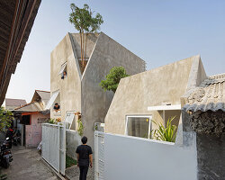 'the twins' by DELUTION are a pair of houses in indonesia with integrated vegetation