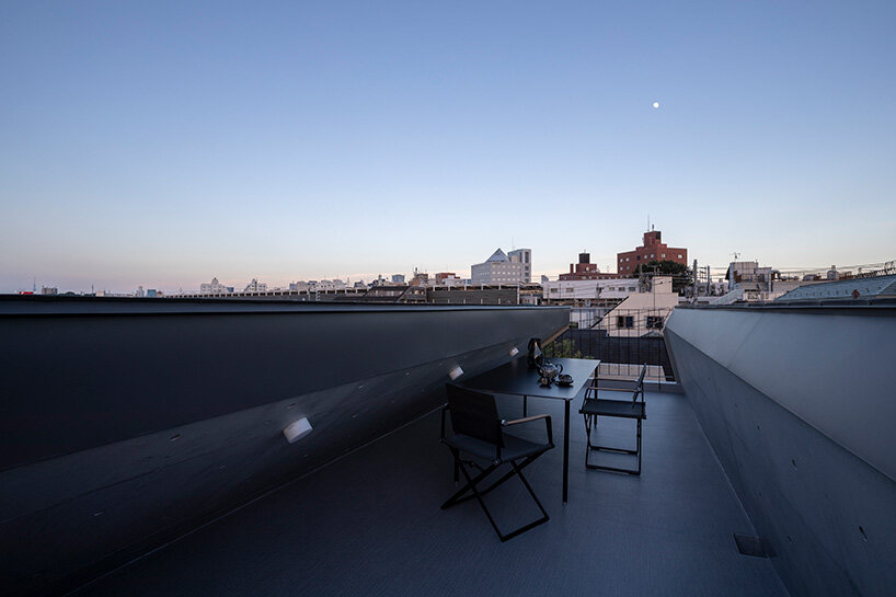 IKAWAYA architects constructs 'embracing' concrete shell house in tokyo