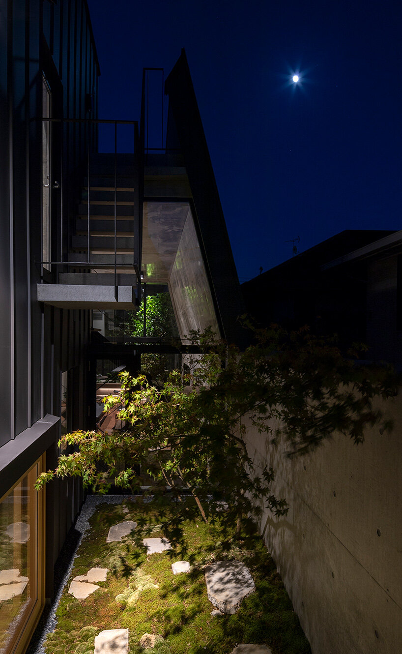 IKAWAYA architects constructs 'embracing' concrete shell house in tokyo