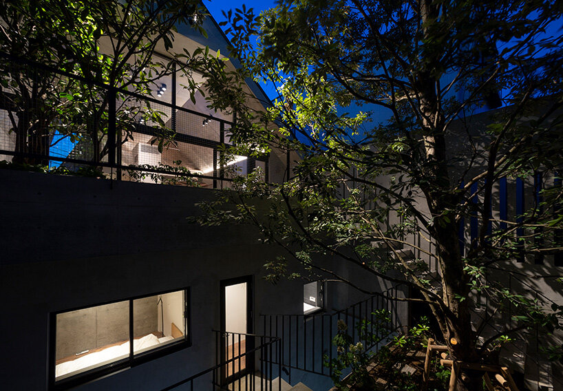 IKAWAYA architects constructs 'embracing' concrete shell house in tokyo