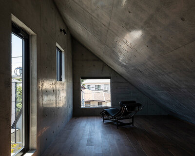 IKAWAYA architects constructs 'embracing' concrete shell house in tokyo