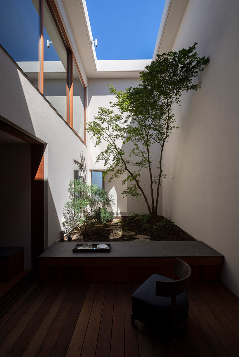 a 'sky cave' crowns this three-storey building in tokyo by IKAWAYA architects