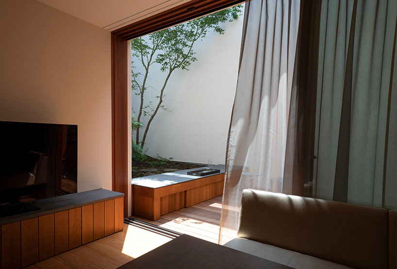 a 'sky cave' crowns this three-storey building in tokyo by IKAWAYA architects