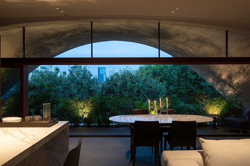 a 'sky cave' crowns this three-storey building in tokyo by IKAWAYA architects