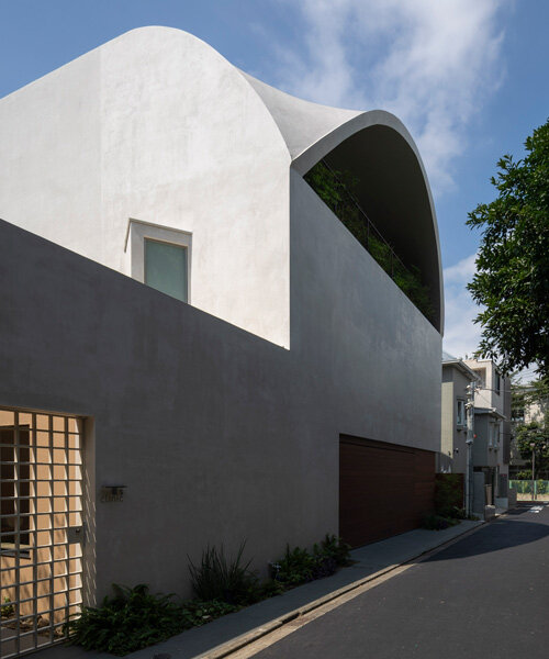 a 'sky cave' crowns this three-storey building in tokyo by IKAWAYA architects