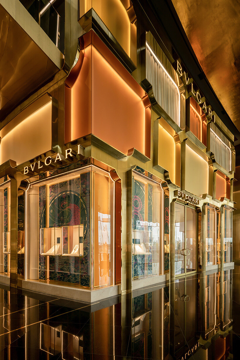 MVRDV references bulgari's first store in rome with brass and glass façade in bangkok