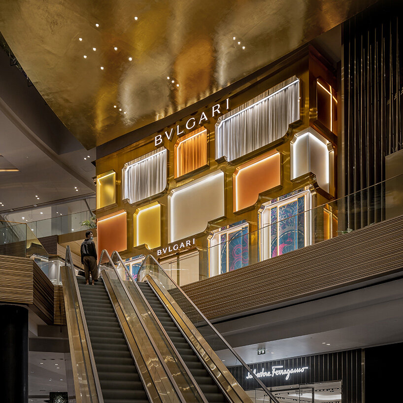 MVRDV references bulgari's first store in rome with brass and glass façade in bangkok