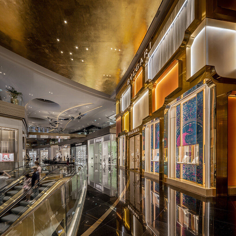 MVRDV references bulgari's first store in rome with brass and glass façade in bangkok