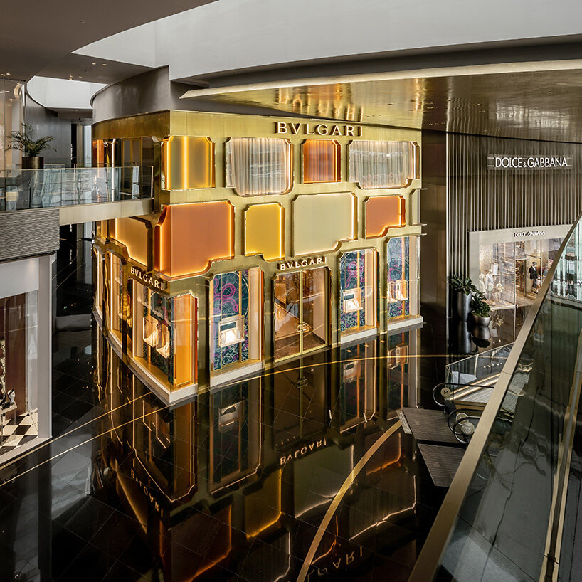 MVRDV references bulgari's first store in rome with brass and glass façade in bangkok