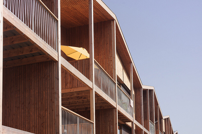 TANK's wooden residential building in nantes exists between urban + rural landscapes