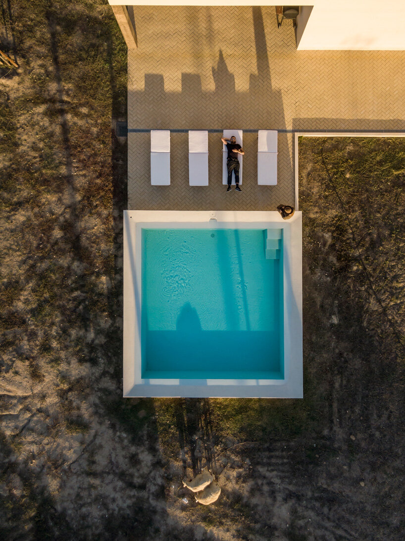 bica arquitectos combines two contiguous volumes into 'house in alentejo' in rural portugal