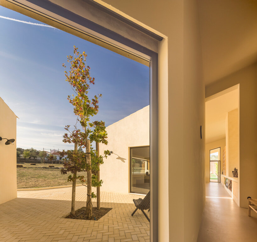 bica arquitectos combines two contiguous volumes into 'house in alentejo' in rural portugal
