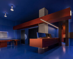 red stainless steel fixtures adorn blue eyewear store interior by WGNB in seoul