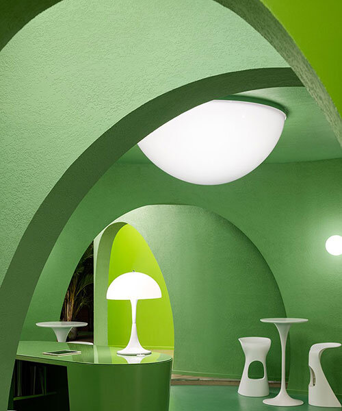 bright green walls and organic shapes form 'space age' style hair salon in beijing