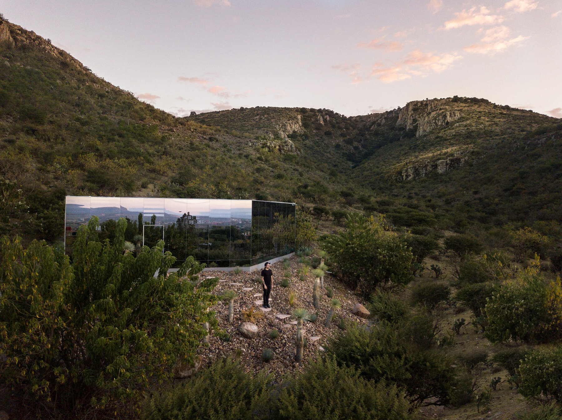 casa etérea is an off-grid glass house set on the slopes of an extinct volcano in mexico