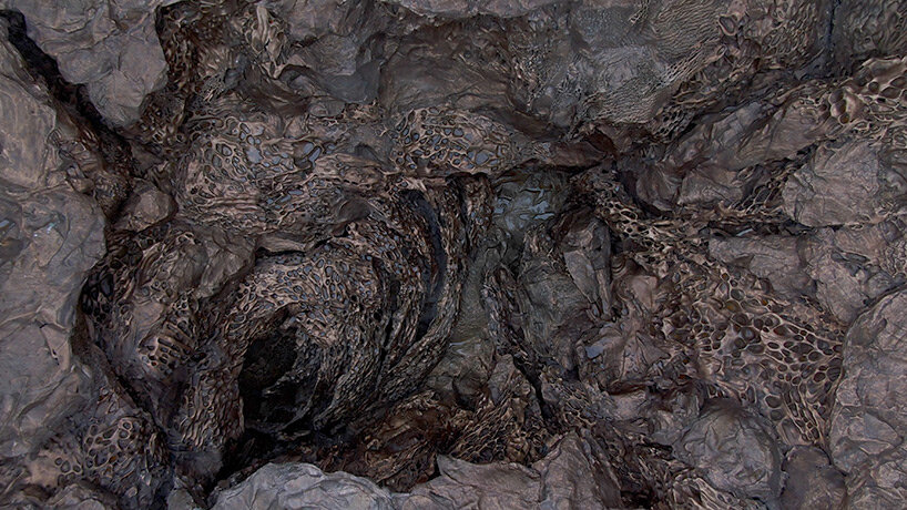 cristina iglesias infills remote island lighthouse with monumental bronze-cast forms