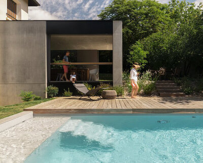 dank architectes reconciles new and old with this concrete extension in france