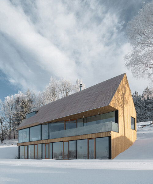 fránek architects embeds a timber-clad house into snowy czech mountains