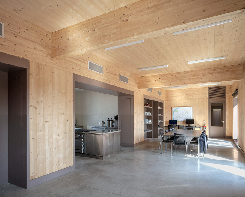 red façades + stacked volumes recall the function of this fire station in antwerp