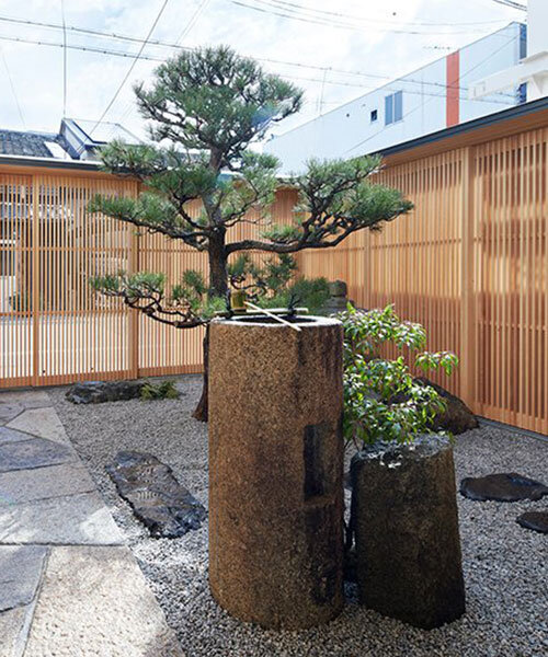 kenzo makino & associates turns parking space into courtyard garden within kyoto