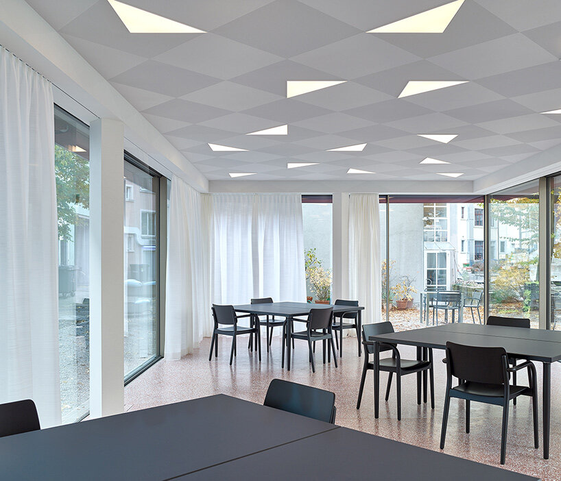 knorr & pürckhauer tops courtyard building in zurich with pre-oxidized copper roof