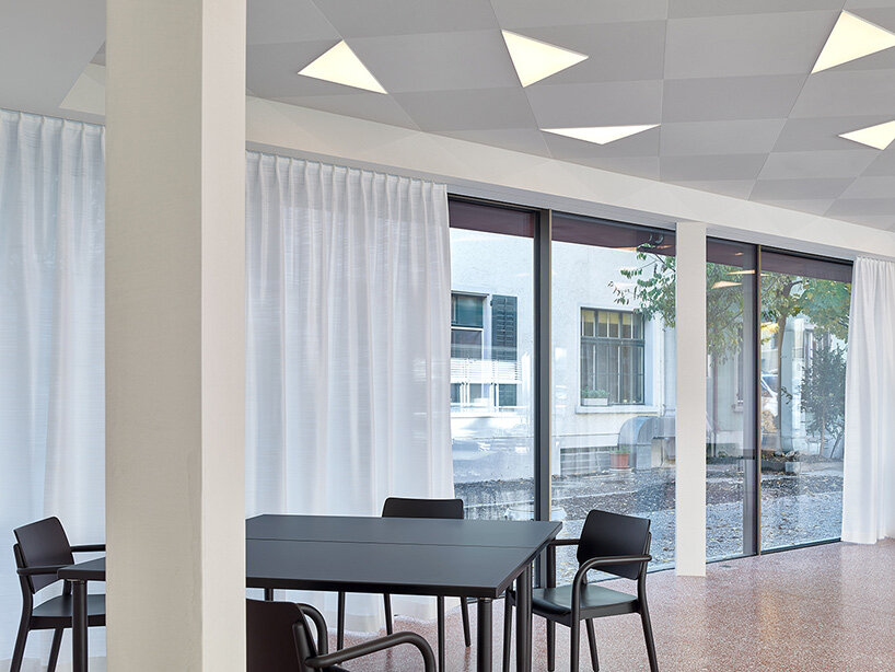 knorr & pürckhauer tops courtyard building in zurich with pre-oxidized copper roof