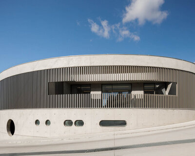studio lopes da costa expands porto steelform factory with sweeping concrete
