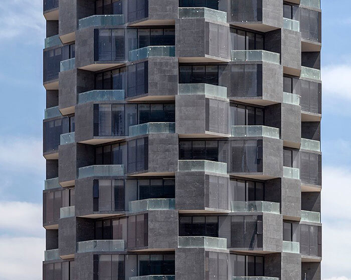 mayer hasbani builds 'adamant' sculptural high-rise in puebla, mexico
