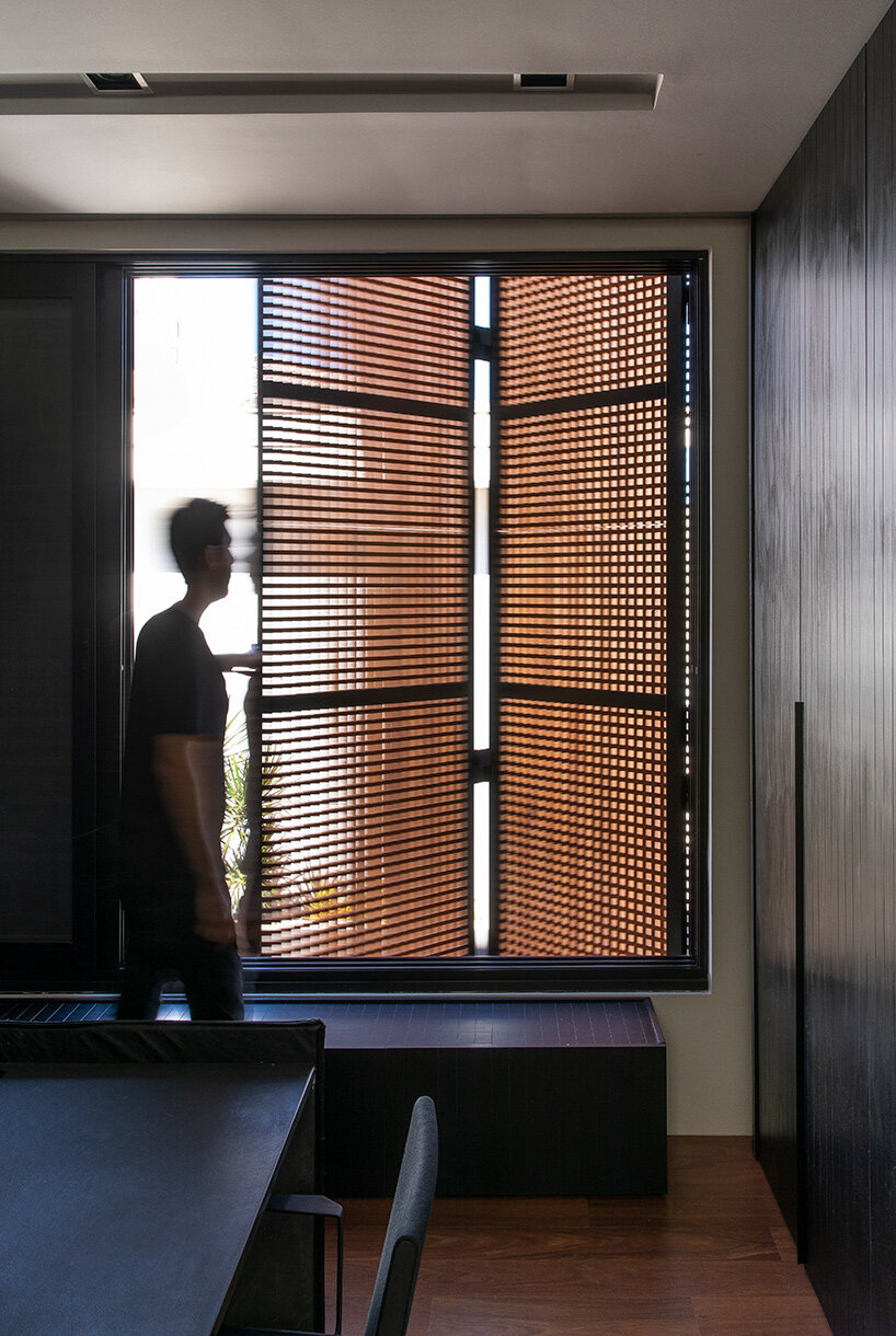 mf+arquitetos clads 'house of jabuticabeiras' in brazil with adjustable wooden louvers