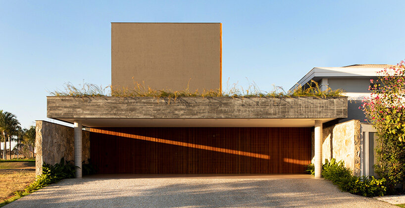 mf+arquitetos clads 'house of jabuticabeiras' in brazil with adjustable wooden louvers