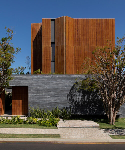 mf+arquitetos clads 'house of jabuticabeiras' in brazil with adjustable wooden louvers