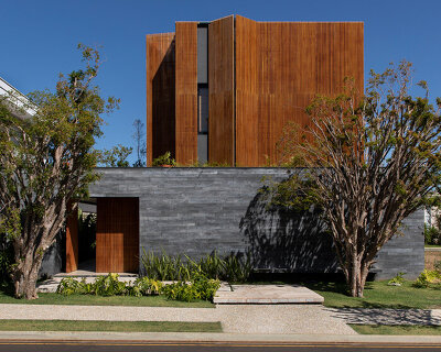 mf+arquitetos clads 'house of jabuticabeiras' in brazil with adjustable wooden louvers