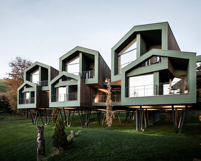 noa* constructs an elevated cluster of volumes with its tyrolean floris hotel