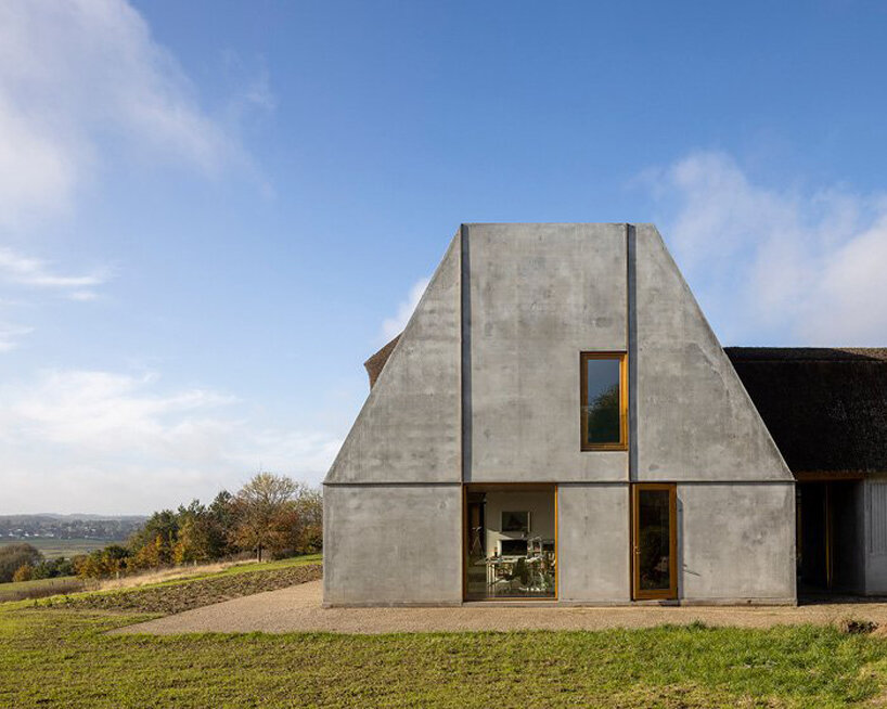 NORRØN adds a modern twist to farmhouse living in rural denmark designboom