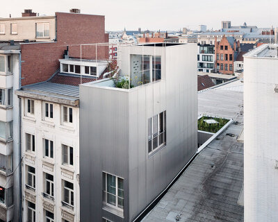 NU architectuuratelier completes a narrow split-level house in the center of ghent