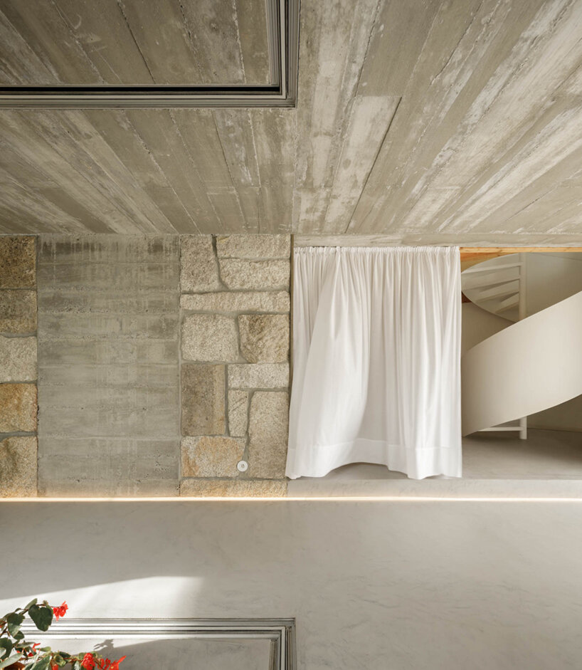 paulo merlini architects recovers derelict portuguese farmhouse with 'casa rio'