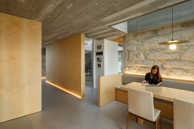 paulo merlini architects recovers derelict portuguese farmhouse with 'casa rio'