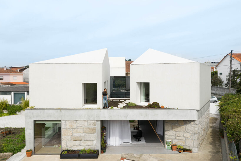 paulo merlini architects recovers derelict portuguese farmhouse with 'casa rio'