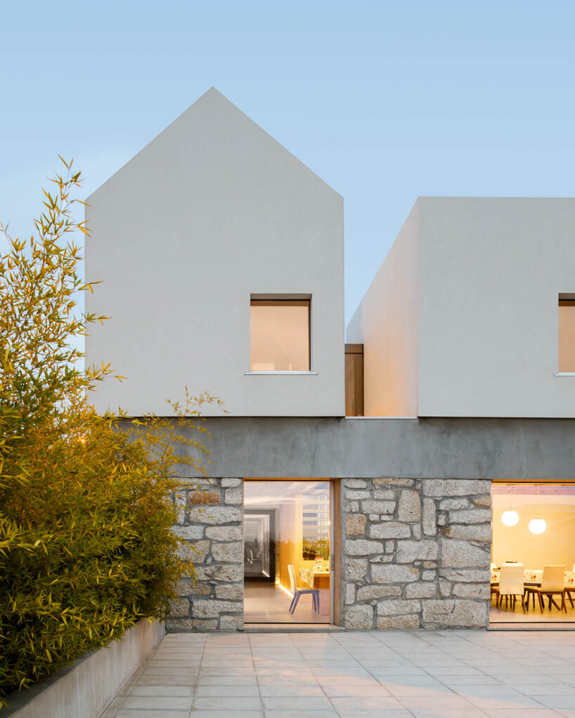 paulo merlini architects recovers derelict portuguese farmhouse with 'casa rio'