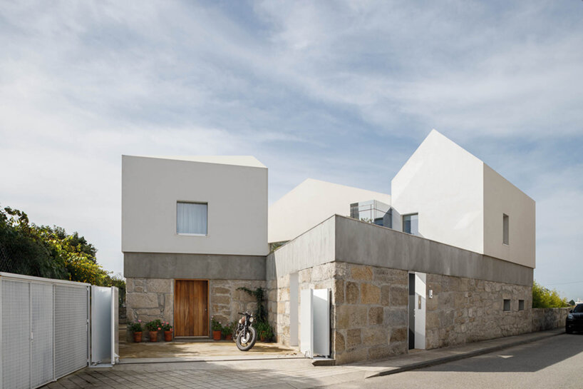 paulo merlini architects recovers derelict portuguese farmhouse with 'casa rio'