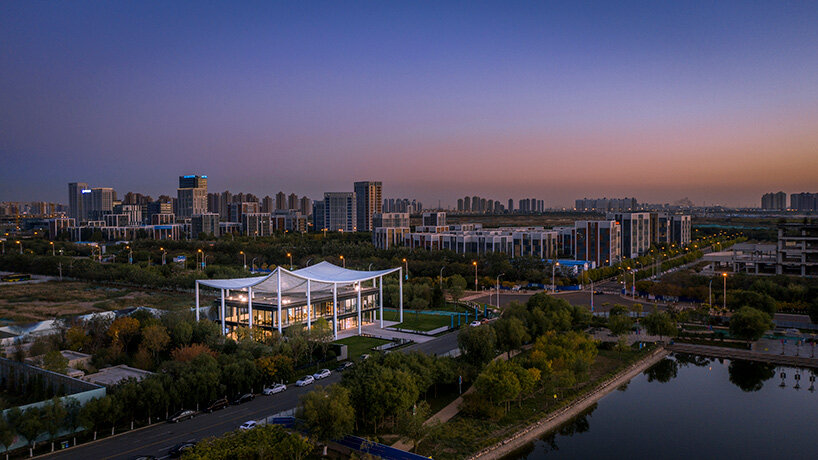 powerhouse company tops reception center for new city district in tianjin with 'paper roof'