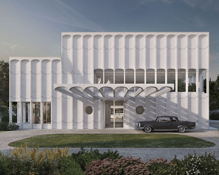 fluted concrete façade wraps PROMONTORIO's egyptian ambassador residence in lisbon