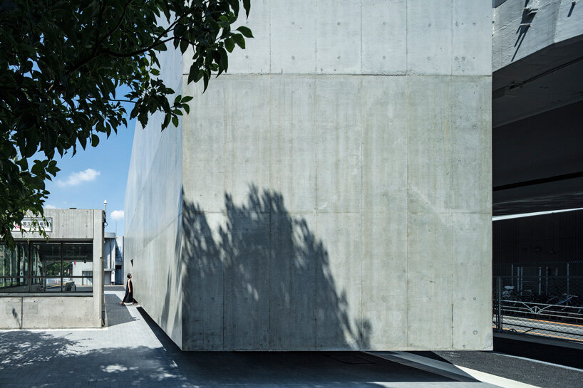 suppose design office shapes toilet in tokyo like floating concrete cube